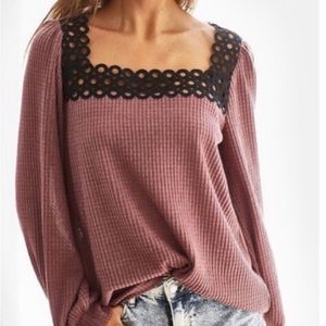 Mauve top with black crochet square trim around neck